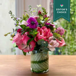 Pink and purple mixed bouquet in a glass vase