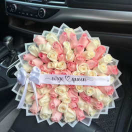 Large bouquet of pink and white roses with a ribbon