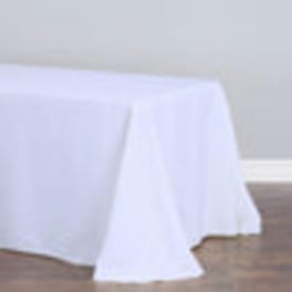White tablecloth draped over a rectangular table