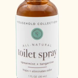 Amber spray bottle labeled toilet spray