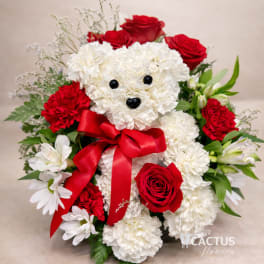 White teddy bear made of flowers with red roses and carnations