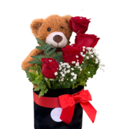 Teddy bear with red roses in a black box tied with a red ribbon