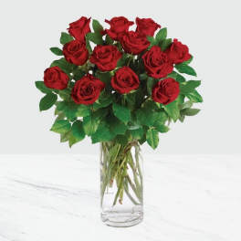 Bouquet of red roses in a clear glass vase