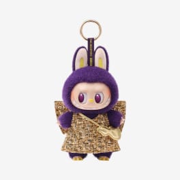 Purple plush keychain doll with bunny ears and a gold outfit