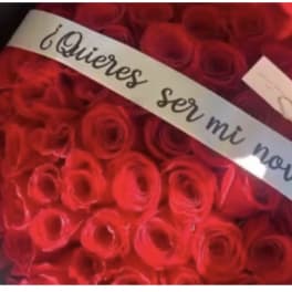 Large bouquet of red roses with a Spanish ribbon