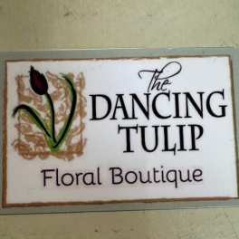 Sign reading The Dancing Tulip Floral Boutique with a tulip graphic