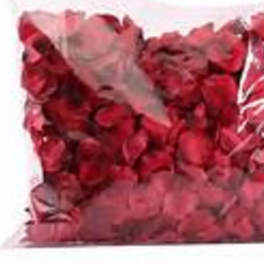 Clear plastic bag filled with loose red rose petals