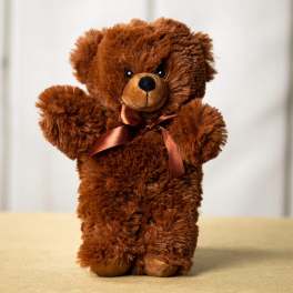 Brown teddy bear with a satin ribbon