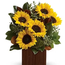 Sunflower arrangement in a wooden box with mixed greenery