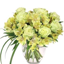 Yellow-green bouquet of roses and alstroemeria in a clear glass vase