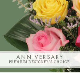 Bouquet of yellow and pink roses with greenery