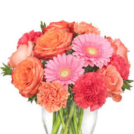 Bouquet of pink and orange flowers in a clear glass vase