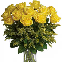 Yellow roses arranged in a clear glass vase