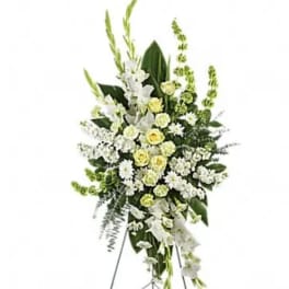 Tall white and pale yellow floral standing spray on an easel