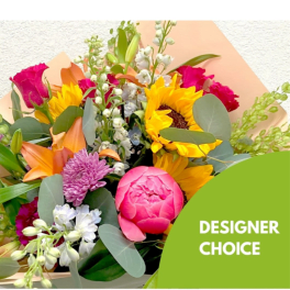 Mixed bouquet with sunflowers, lilies, roses, and pink peonies
