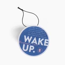 Round blue hanging sign with the words "WAKE UP."