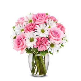 Pink roses and carnations with white daisies in a glass vase