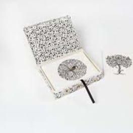 Decorative gift box with a patterned lid and matching heart and tree pieces