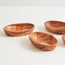 Four small wooden bowls on a white background