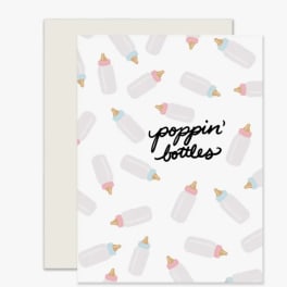 Greeting card with baby bottle pattern and "poppin' bottles" text