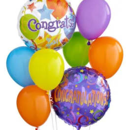 Colorful congratulatory balloons with two printed foil balloons and several latex balloons