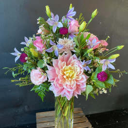 Pink and lavender mixed bouquet in a clear glass vase