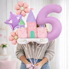 Person holding pastel castle and number 5 balloons with flower balloons