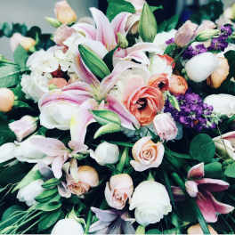 Bouquet of pink lilies, roses, and purple flowers