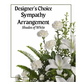 White sympathy arrangement with lilies and carnations