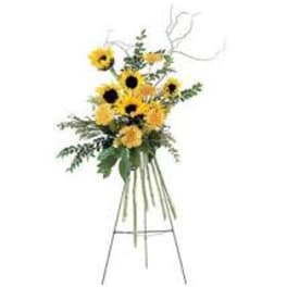 Tall sunflower arrangement on a metal stand