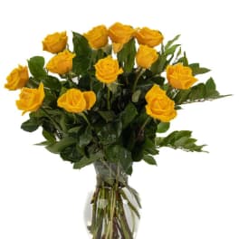 Yellow roses arranged in a clear glass vase