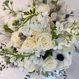 White rose and anemone bouquet with airy white blossoms