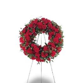 Red floral wreath on a standing easel