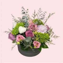 Candle By Flowers