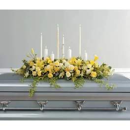 Candles And Flowers For The Casket