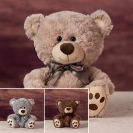 Plush teddy bears with satin bows in beige, gray, and brown