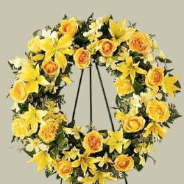 Yellow floral wreath on a black stand