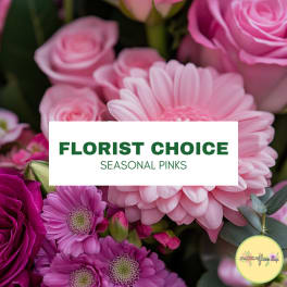 Pink mixed flowers with a florist choice seasonal pinks label