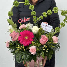 Pink and white mixed bouquet in a gift box with a heart-shaped green accent