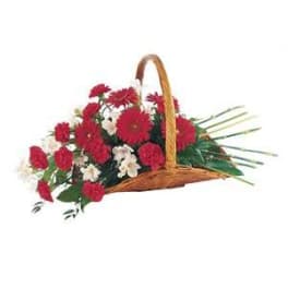 Basket of red and white flowers with a woven handle