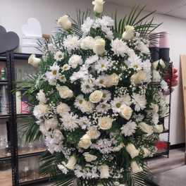 Large white floral standing spray with roses and daisies