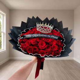 Large bouquet of red roses with a crown and black wrap