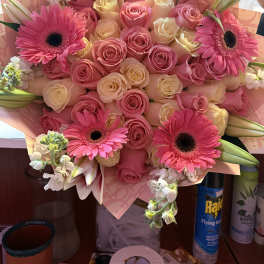 Pink and cream rose bouquet with hot pink gerbera daisies and lilies