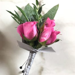 Pink rose boutonniere with silver ribbon wrap