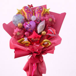 Pink balloon bouquet with butterfly and birthday balloons