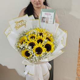 Bouquet of sunflowers with baby's breath in white and gold wrap