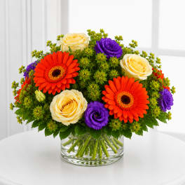 Gerbera daisies, yellow roses and purple flowers