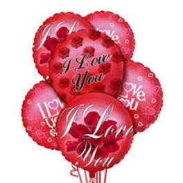 Cluster of red heart-shaped balloons with love messages