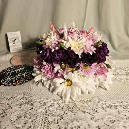 Round bouquet of pink, white, and purple daisies with birthday picks