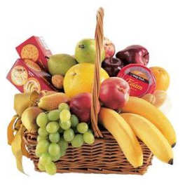 Fruit basket with bananas, grapes, apples, and packaged snacks